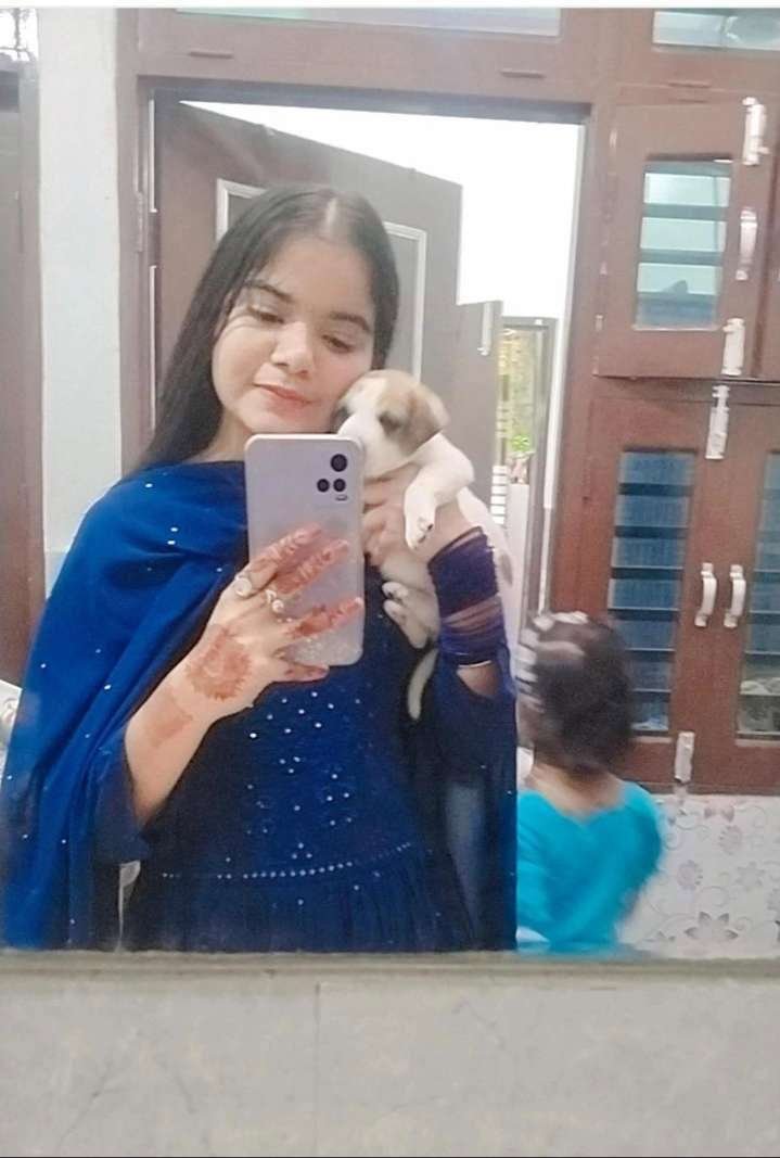 Bhoomi sharing a tender moment with a puppy
